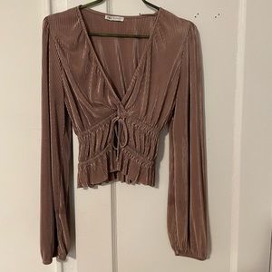 Champagne color long sleeve top. Good to dress down or for the office S size